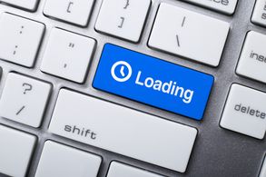 Loading Button On Keyboard symbolizing page load speed as a critical web design element.