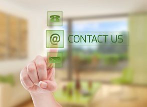 Person pointing to a digital icon that says contact us.